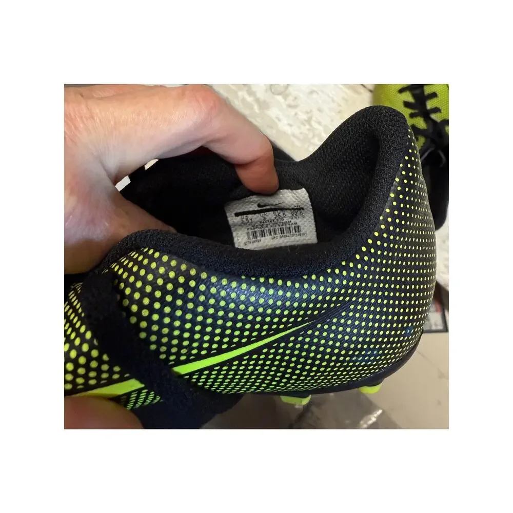 Nike black and yellow cleats size 3.5